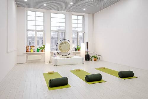 Instructor guiding a mindful yoga class
