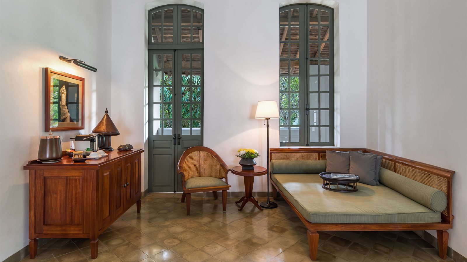 Bright living room with tall glazed doors and daybed seating